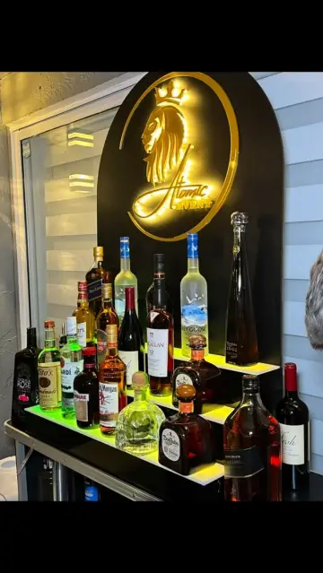 Lit bottle shelf under the lion