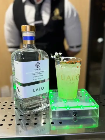 Green cocktail on an LED riser