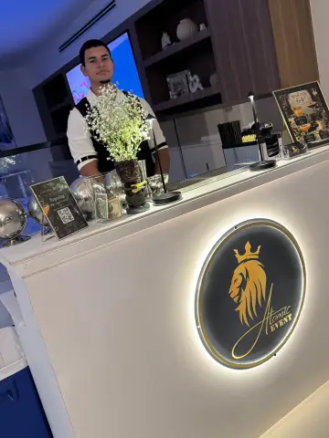 White bar with the lit lion crest